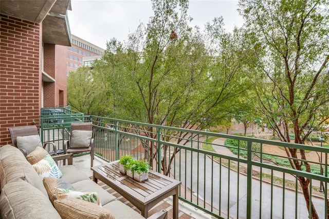 a view of a balcony with furniture