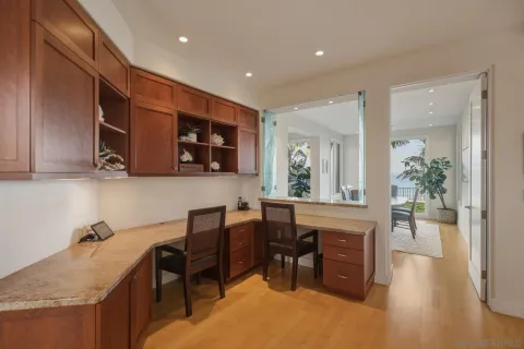 a kitchen with sink cabinets and dining table