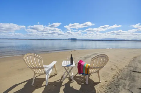 a view of a chairs and table in patio