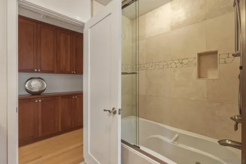 a bathroom with a bathtub and a shower