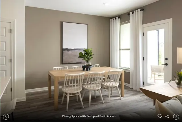 a dining room with furniture and window