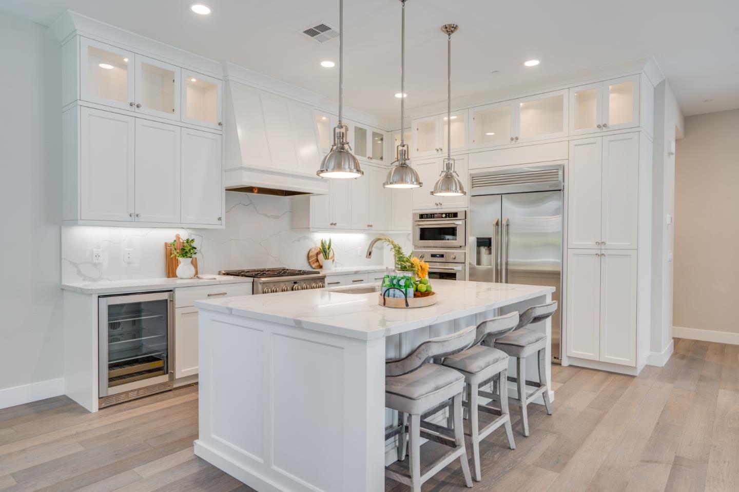 3114 Contreras Drive San Mateo, CA 94403 - Photo 12 of 44 a kitchen with kitchen island a stove a table and chairs in it