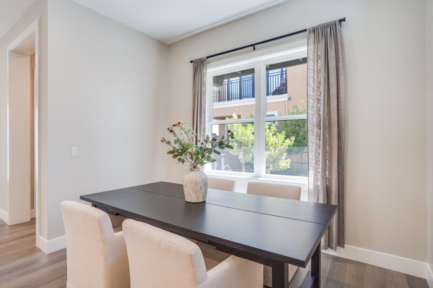 3114 Contreras Drive San Mateo, CA 94403 - Photo 16 of 44 a dining room with a table and chairs