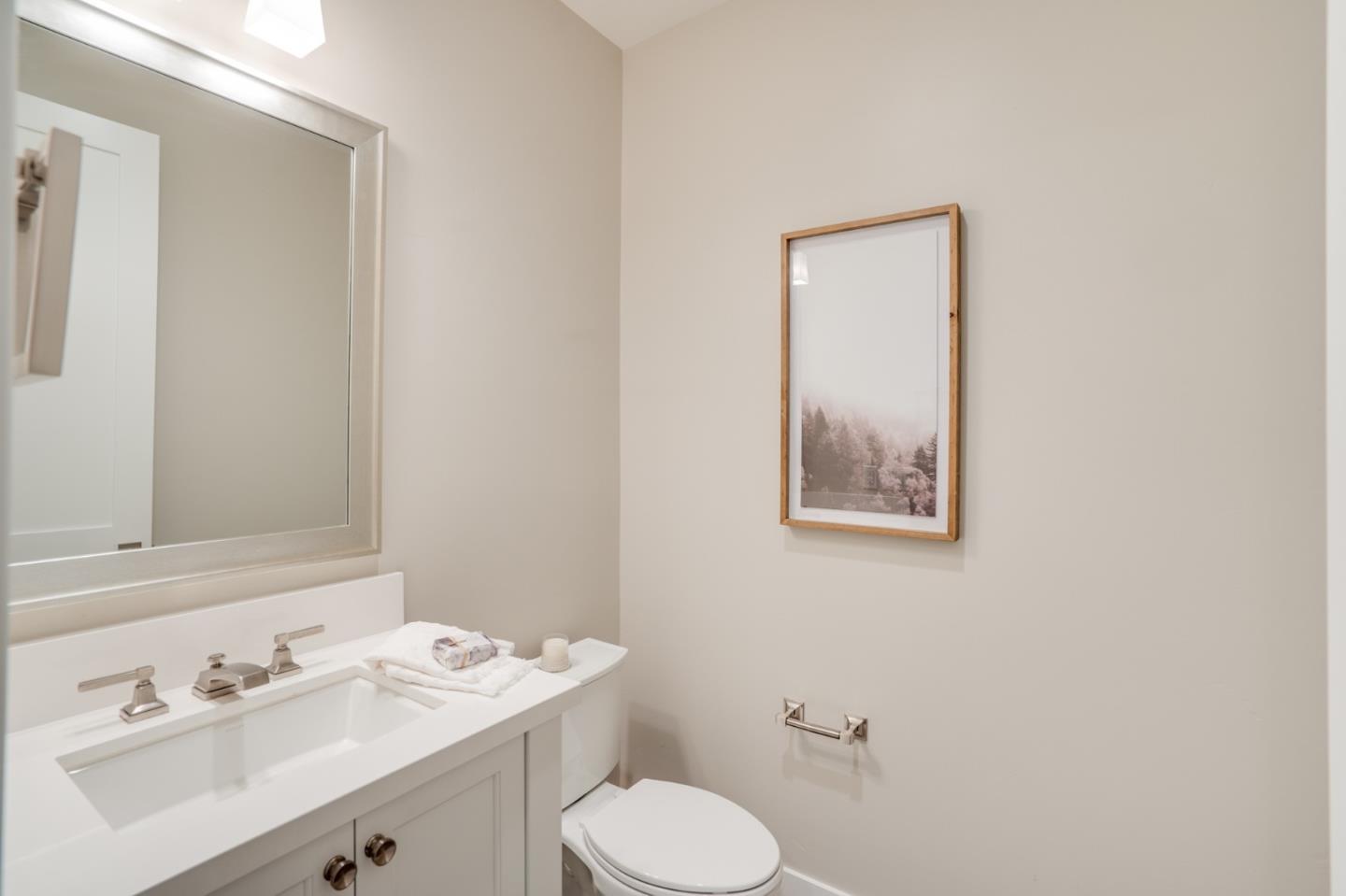 3114 Contreras Drive San Mateo, CA 94403 - Photo 18 of 44 a bathroom with a toilet sink vanity and mirror