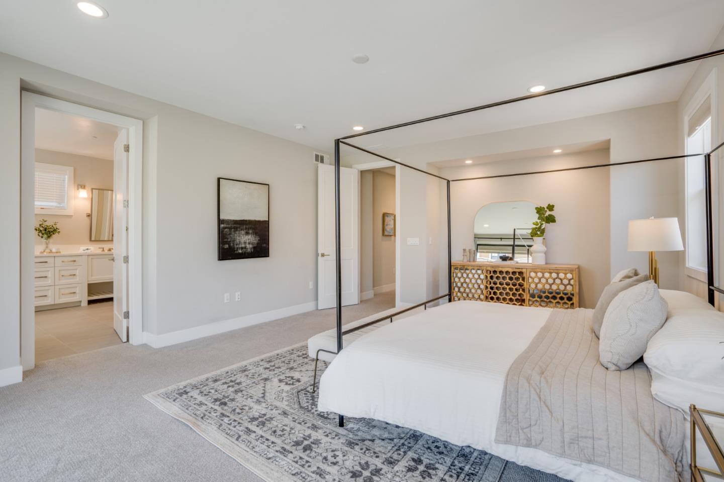 3114 Contreras Drive San Mateo, CA 94403 - Photo 20 of 44 a bedroom with a large bed and a chandelier