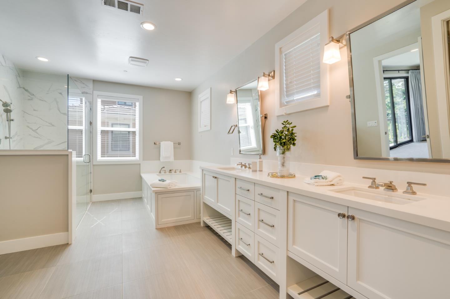 3114 Contreras Drive San Mateo, CA 94403 - Photo 26 of 44 a bathroom with double vanity sink a mirror and a bathtub