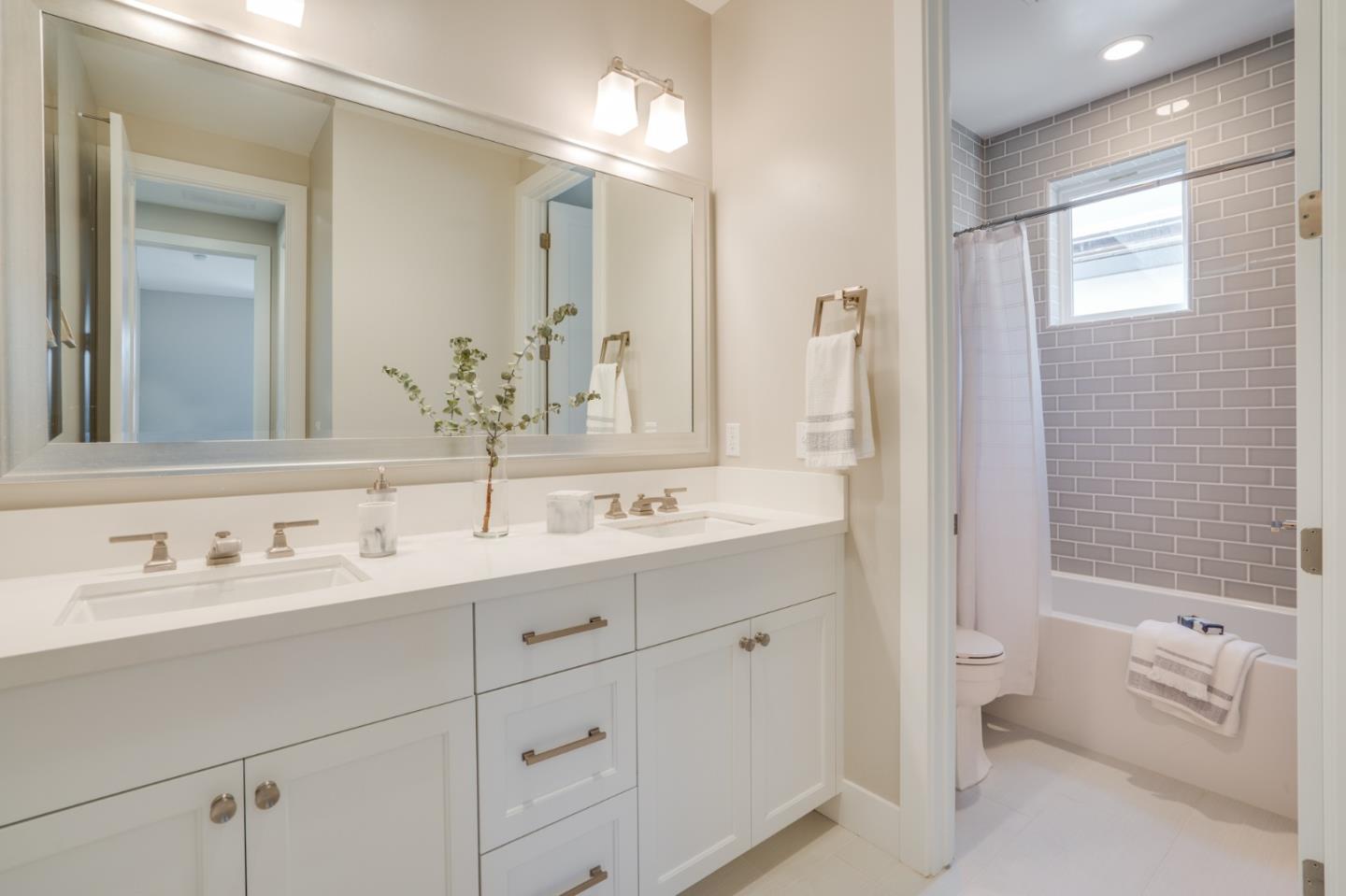3114 Contreras Drive San Mateo, CA 94403 - Photo 34 of 44 a bathroom with a double vanity sink mirror and bathtub
