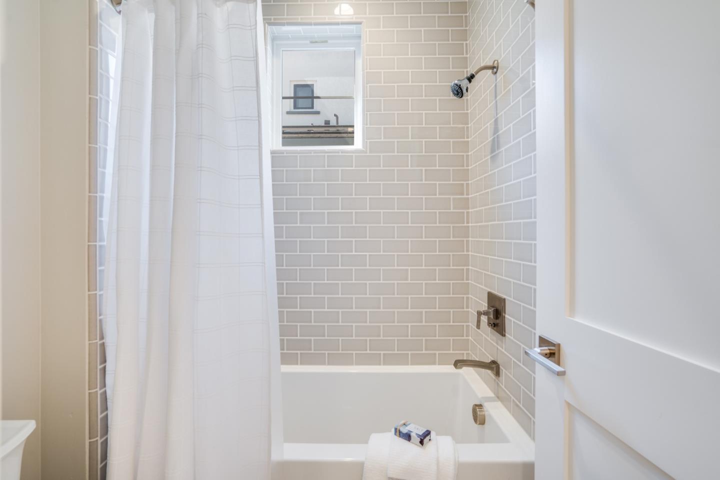 3114 Contreras Drive San Mateo, CA 94403 - Photo 35 of 44 a bathroom with a bathtub and shower