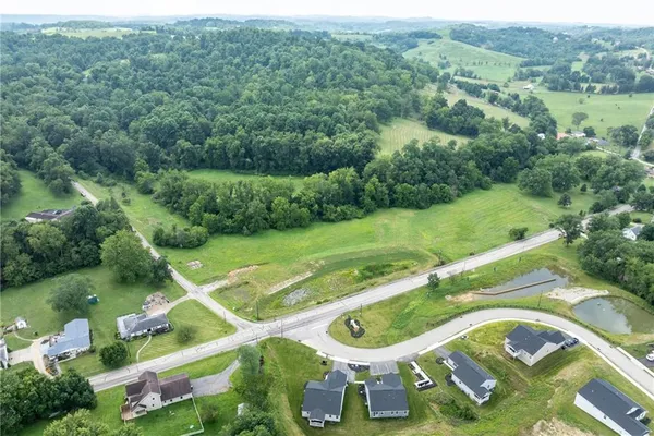 an aerial view of a house with yard swimming pool and outdoor seating