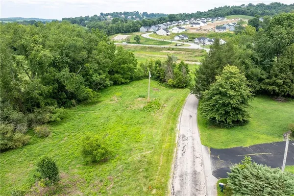 a view of a lake with a yard