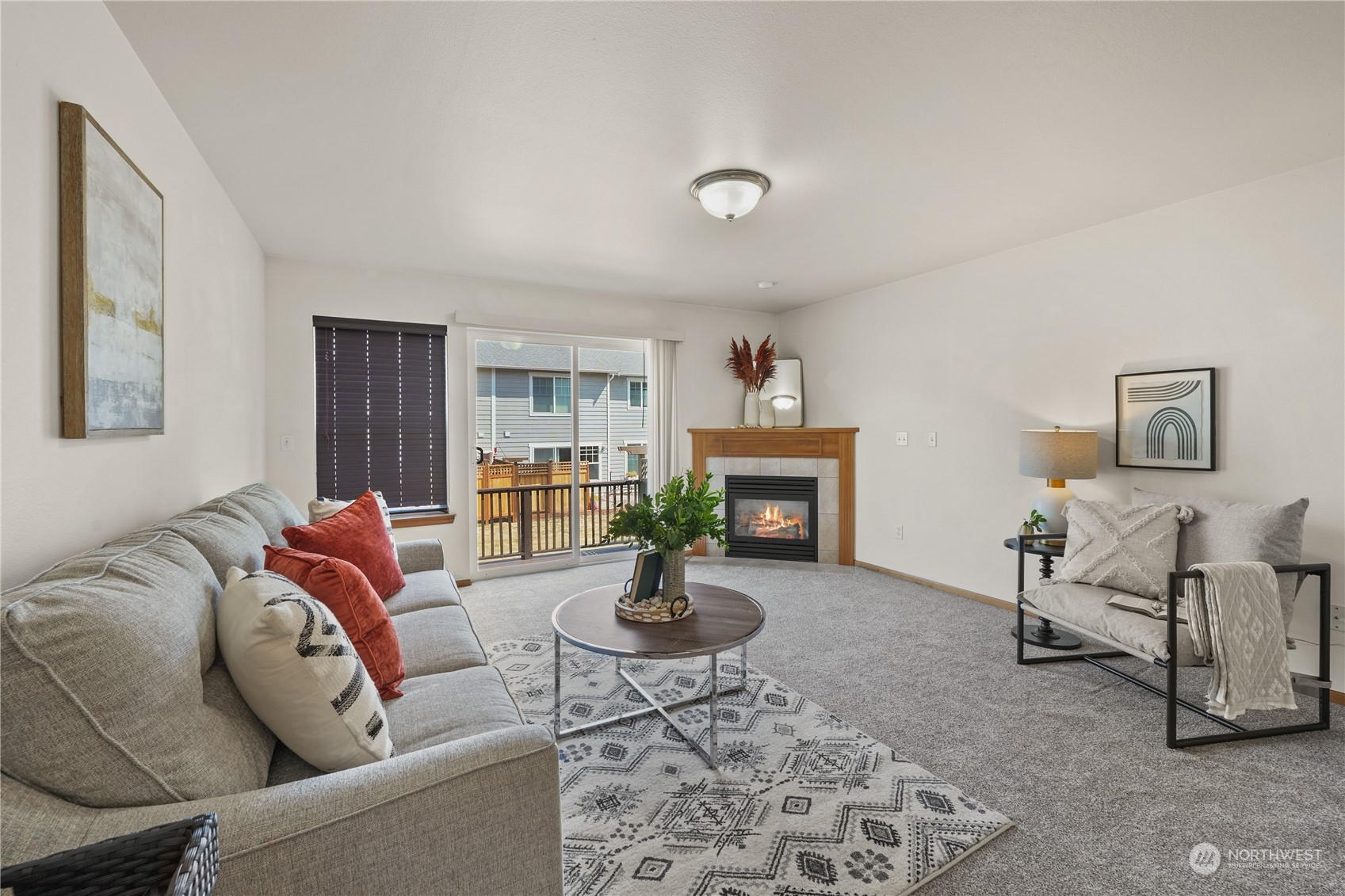 2114 19th Street Anacortes, WA 98221 - Photo 12 of 35 a living room with furniture a rug and a fireplace