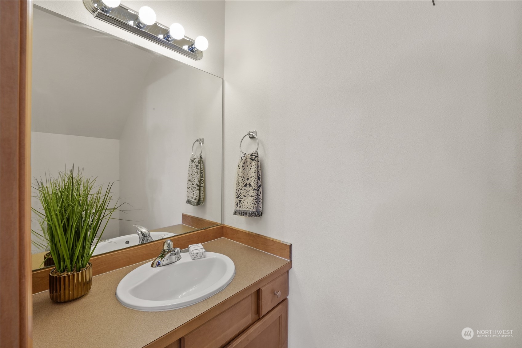 2114 19th Street Anacortes, WA 98221 - Photo 15 of 35 a bathroom with a sink and a mirror