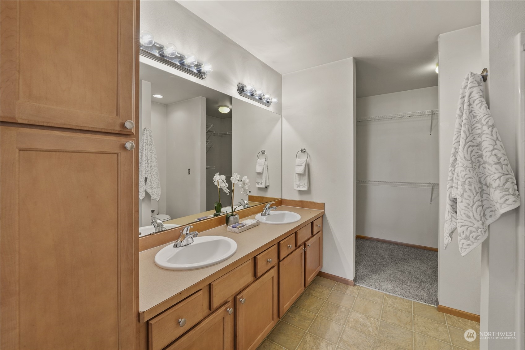 2114 19th Street Anacortes, WA 98221 - Photo 19 of 35 a bathroom with a double vanity sink mirror and shower