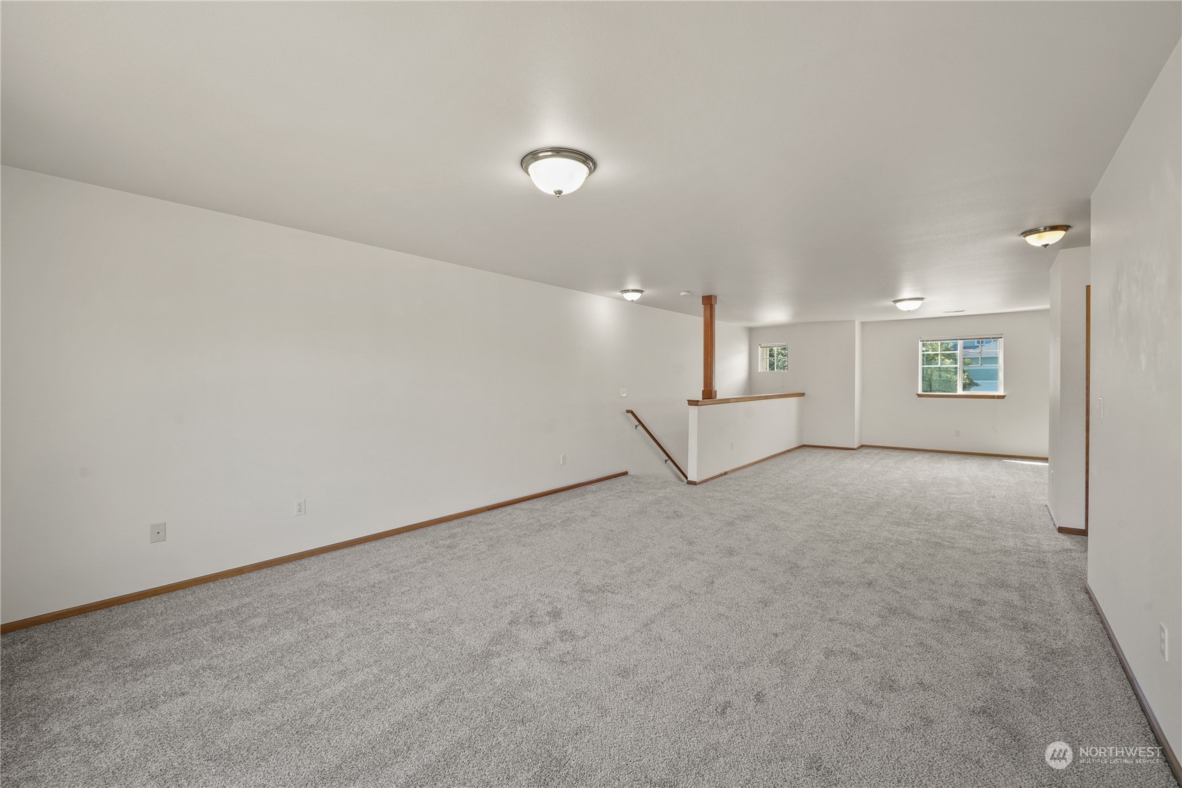 2114 19th Street Anacortes, WA 98221 - Photo 23 of 35 an empty room with white walls and windows