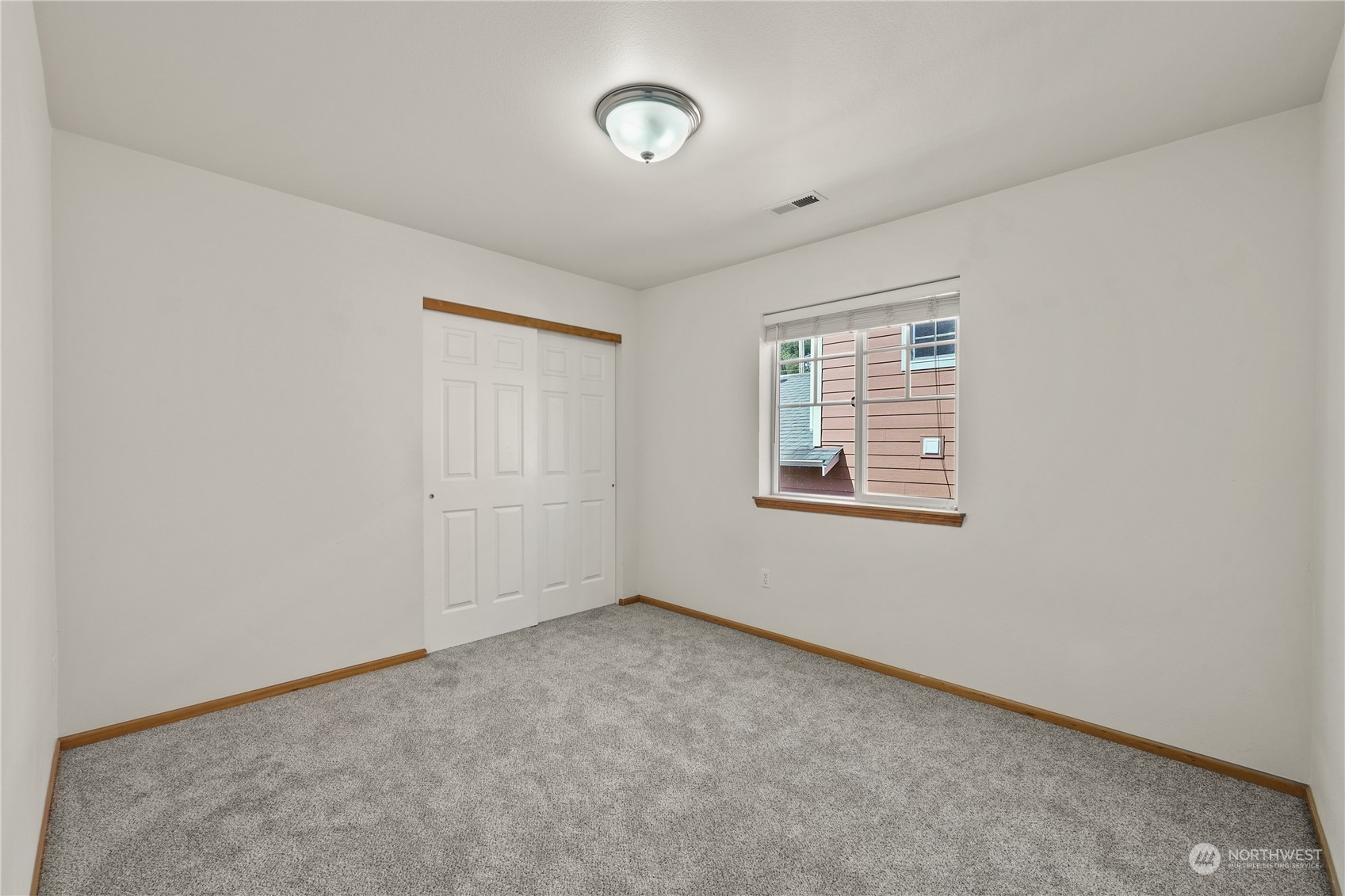 2114 19th Street Anacortes, WA 98221 - Photo 27 of 35 an empty room with a empty space and windows