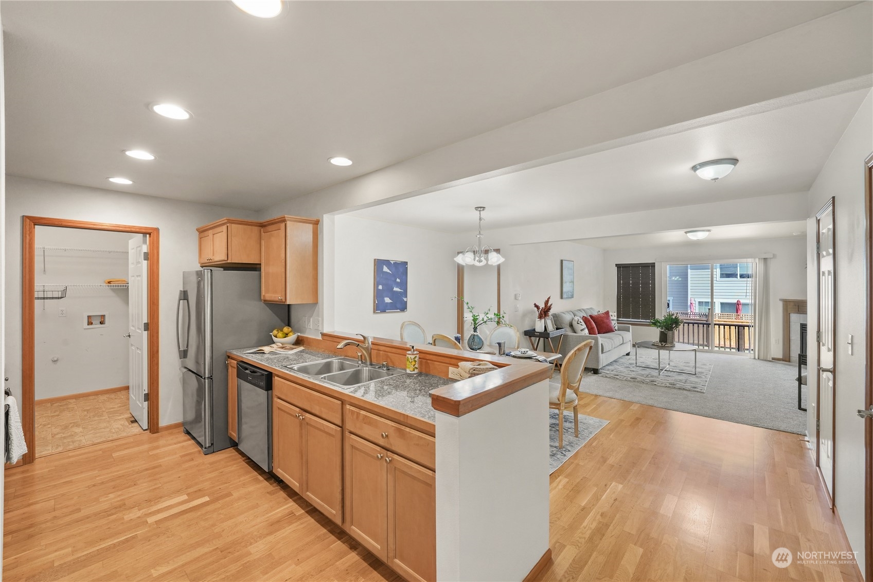 2114 19th Street Anacortes, WA 98221 - Photo 3 of 35 a kitchen with stainless steel appliances granite countertop a refrigerator and a sink