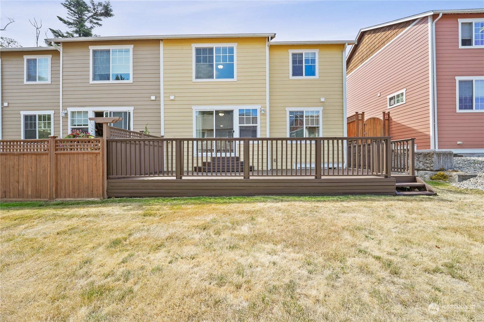 2114 19th Street Anacortes, WA 98221 - Photo 35 of 35 a view of a house with a wooden fence