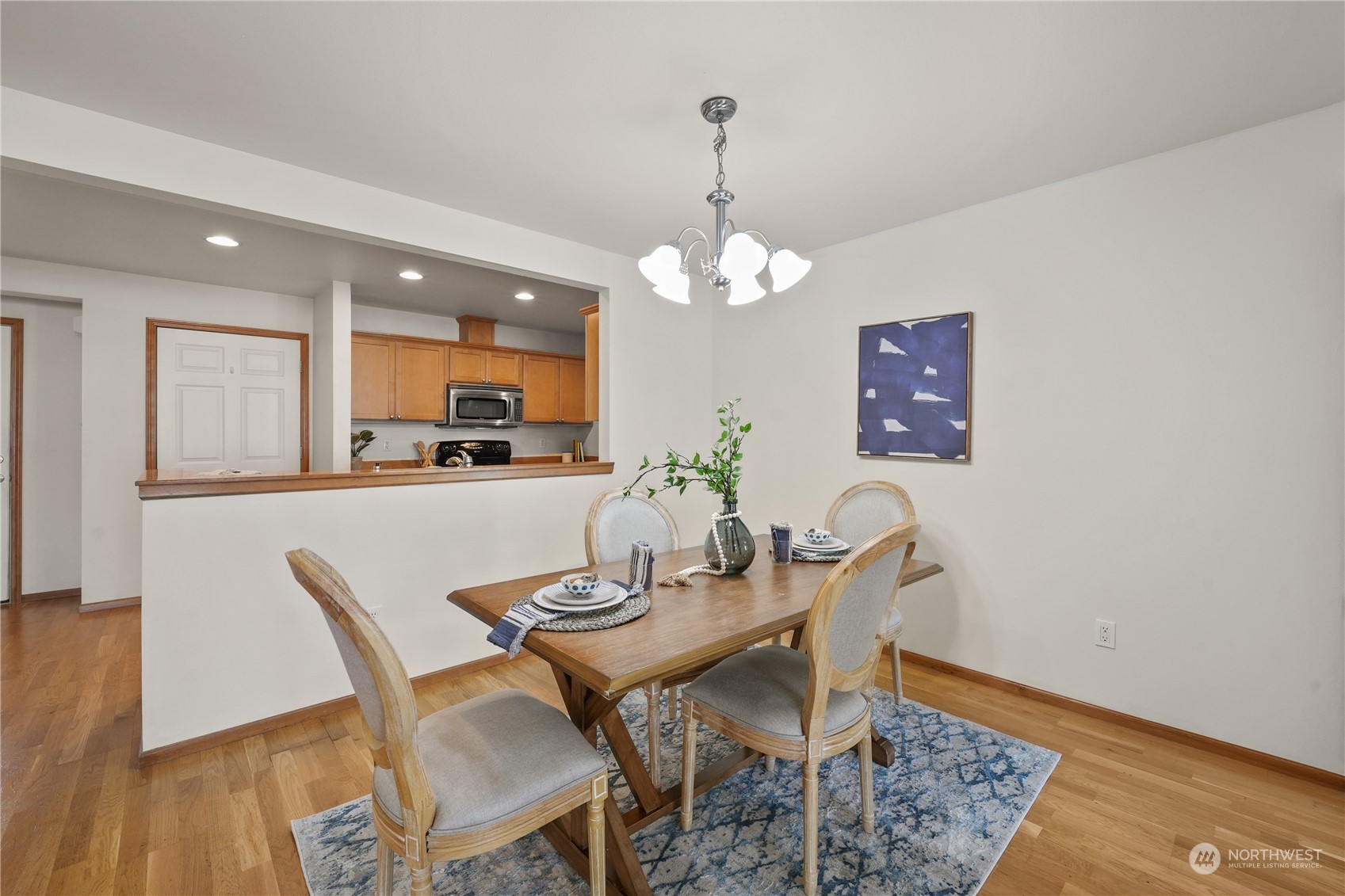 2114 19th Street Anacortes, WA 98221 - Photo 9 of 35 a view of a dining room with furniture and wooden floor