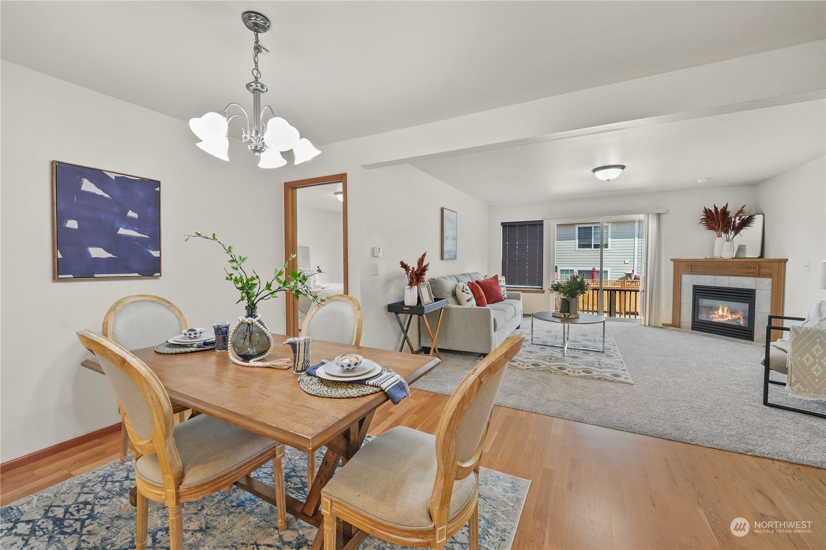 2114 19th Street Anacortes, WA 98221 - Photo 10 of 35 a view of a dining room with furniture a chandelier and wooden floor