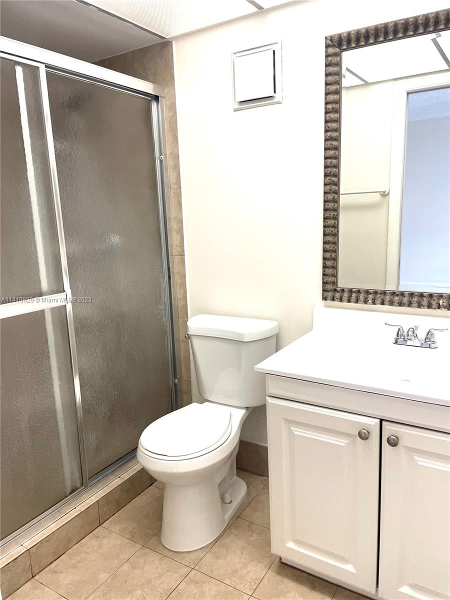 8600 Southwest 133rd Avenue Road, Unit 416 Miami, FL 33183 - Photo 13 of 23 a bathroom with a sink toilet and shower