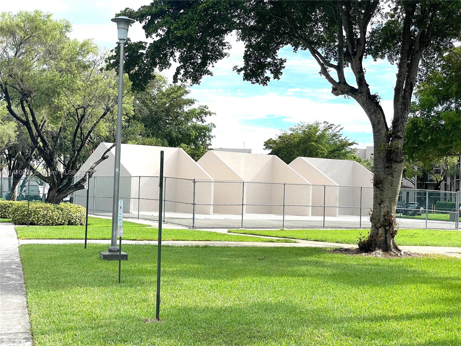 8600 Southwest 133rd Avenue Road, Unit 416 Miami, FL 33183 - Photo 18 of 23 a view of a house with a backyard