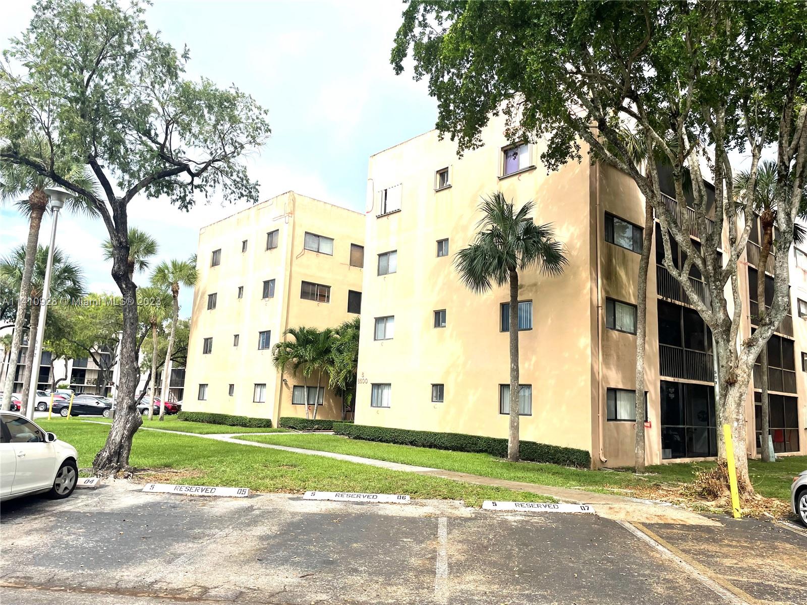 8600 Southwest 133rd Avenue Road, Unit 416 Miami, FL 33183 - Photo 2 of 23 a view of a building with a yard