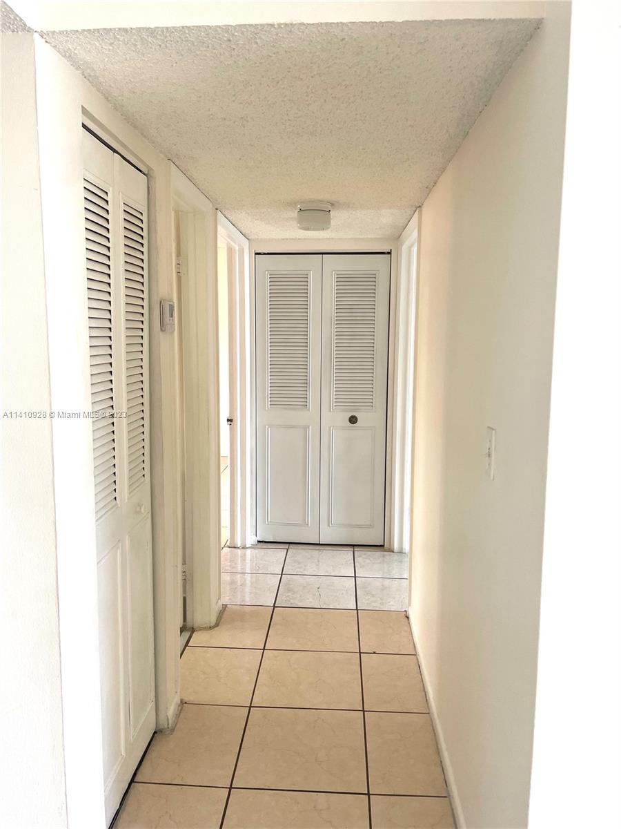 8600 Southwest 133rd Avenue Road, Unit 416 Miami, FL 33183 - Photo 8 of 23 a view of a livingroom with an empty space and a window