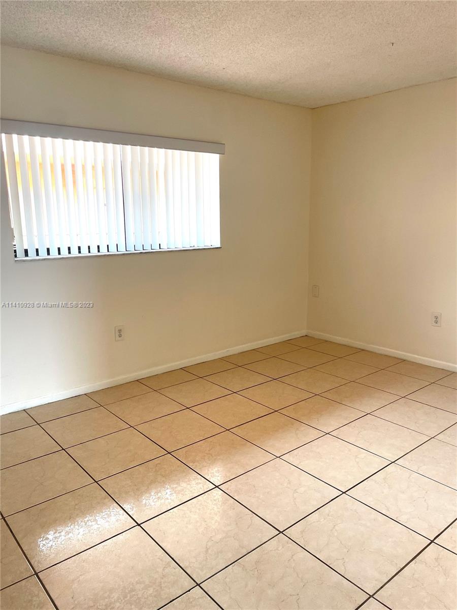8600 Southwest 133rd Avenue Road, Unit 416 Miami, FL 33183 - Photo 9 of 23 a view of an empty room and a window
