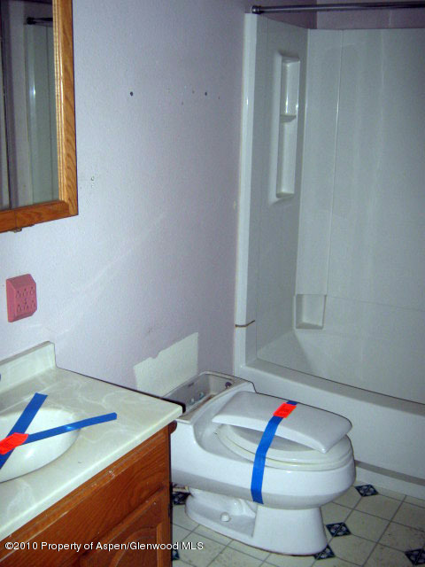 323 East 2nd Street Rifle, CO 81650 - Photo 3 of 5 a bathroom with a sink and a toilet