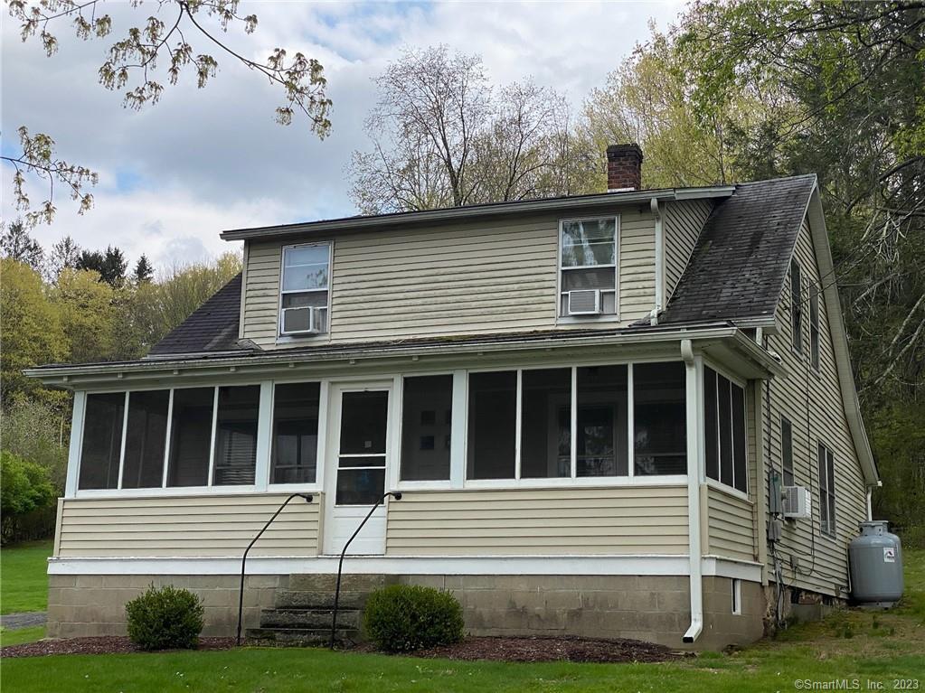 12 White Deer Rocks Road Woodbury, CT 06798 - Photo 1 of 1 a front view of a house with a yard