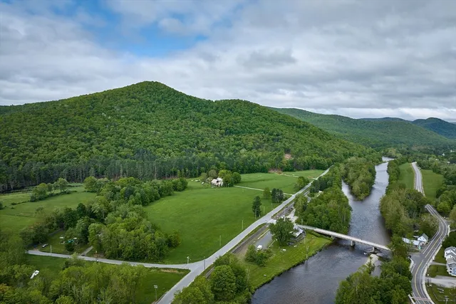 a aerial view of a house with a yard