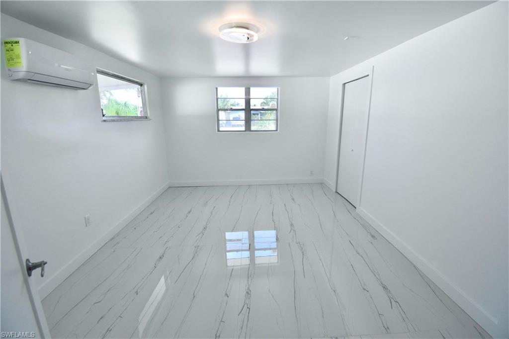 2116 Pineview Road Fort Myers, FL 33901 - Photo 14 of 25 an empty room with windows