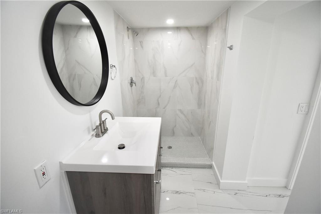 2116 Pineview Road Fort Myers, FL 33901 - Photo 16 of 25 a bathroom with a sink and a mirror