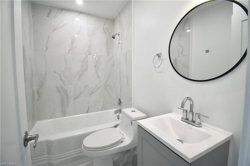 2116 Pineview Road Fort Myers, FL 33901 - Photo 19 of 25 a bathroom with a sink toilet and a mirror