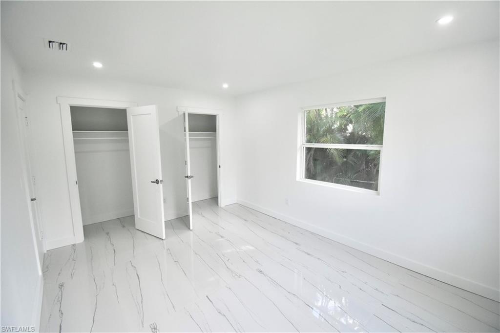 2116 Pineview Road Fort Myers, FL 33901 - Photo 20 of 25 an empty room with closet and windows