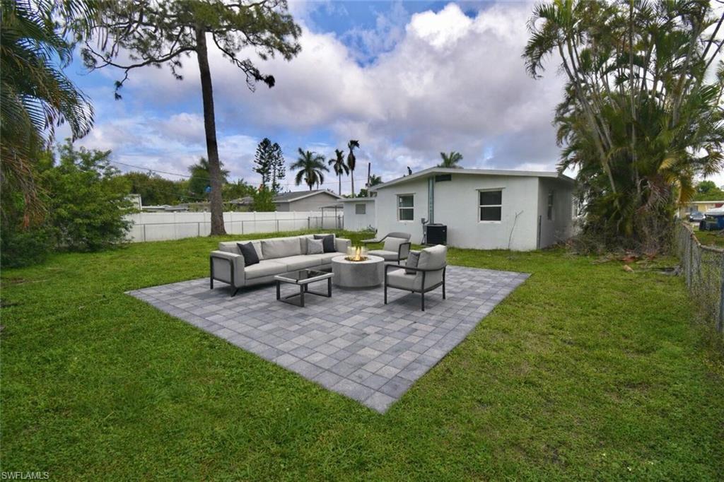 2116 Pineview Road Fort Myers, FL 33901 - Photo 24 of 25 a view of a house with backyard sitting area and garden