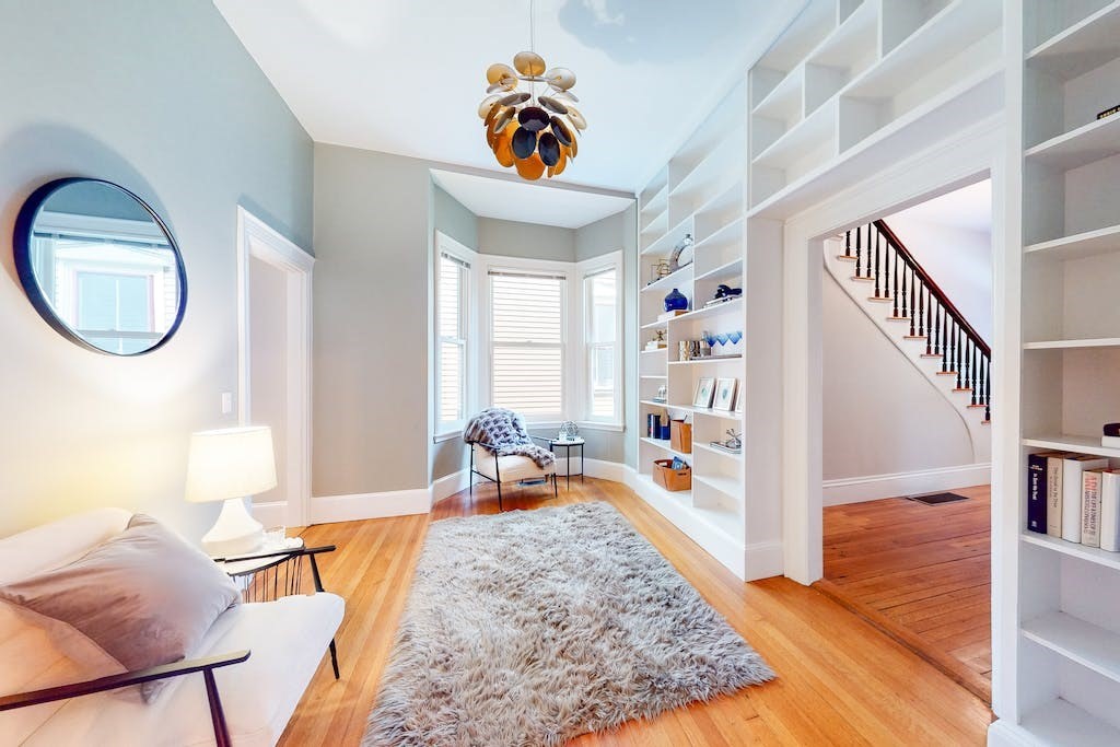 27 Inman Street Cambridge, MA 02139 - Photo 11 of 32 a living room with furniture and a wooden floor