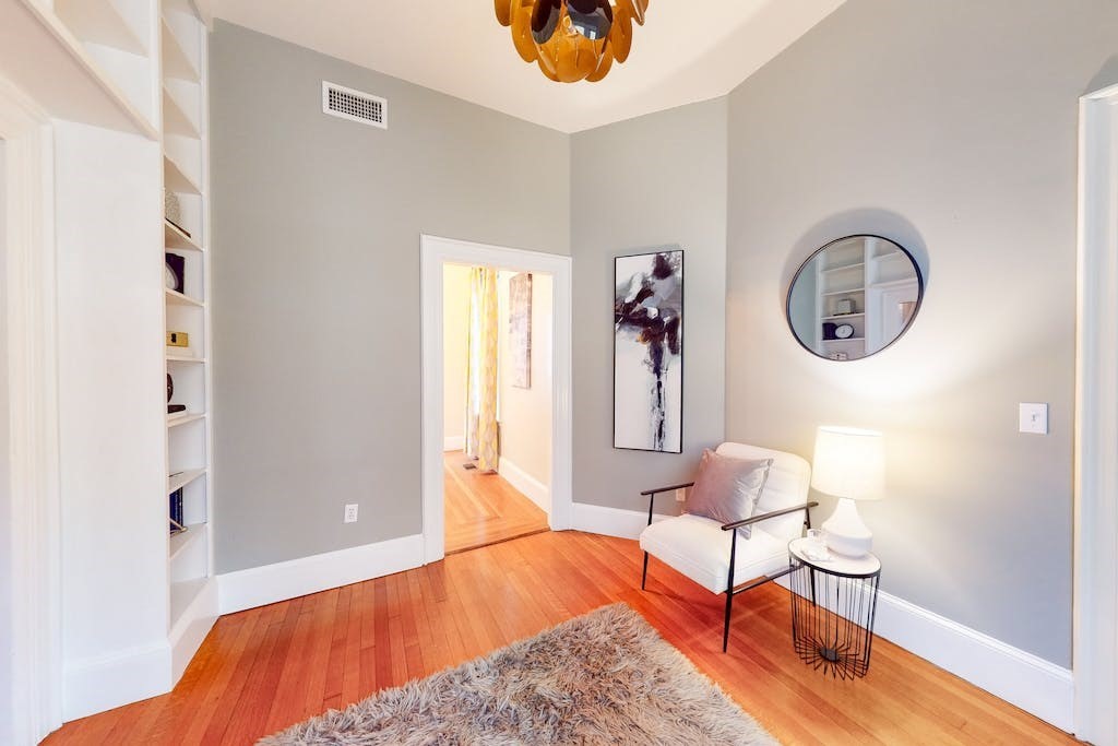 27 Inman Street Cambridge, MA 02139 - Photo 12 of 32 a bedroom with furniture and a window