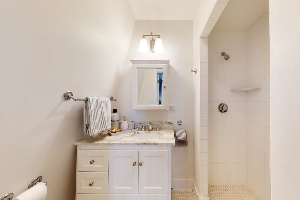27 Inman Street Cambridge, MA 02139 - Photo 16 of 32 a bathroom with a sink vanity and mirror