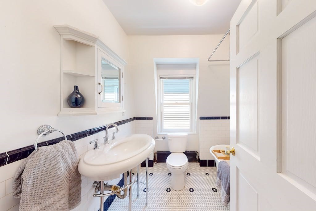 27 Inman Street Cambridge, MA 02139 - Photo 20 of 32 a bathroom with a sink and a mirror