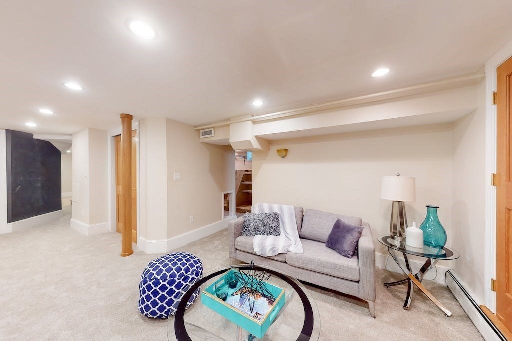 27 Inman Street Cambridge, MA 02139 - Photo 22 of 32 a living room with furniture and a rug