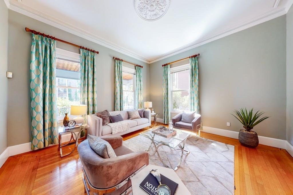 27 Inman Street Cambridge, MA 02139 - Photo 5 of 32 a living room with patio furniture and floor to ceiling windows