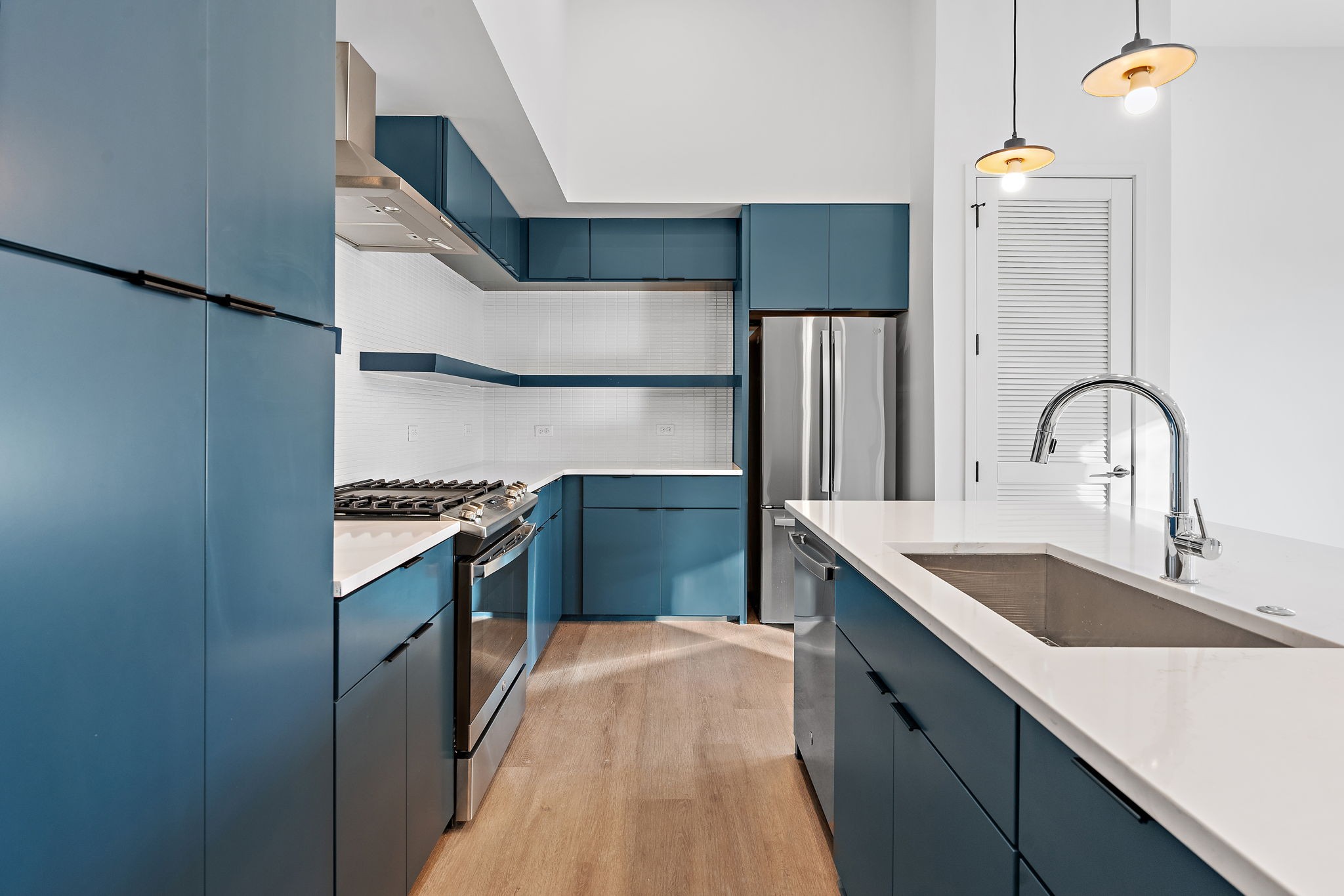504 Merritt Avenue Nashville, TN 37203 - Photo 11 of 23 a kitchen with kitchen island granite countertop a sink and a stove