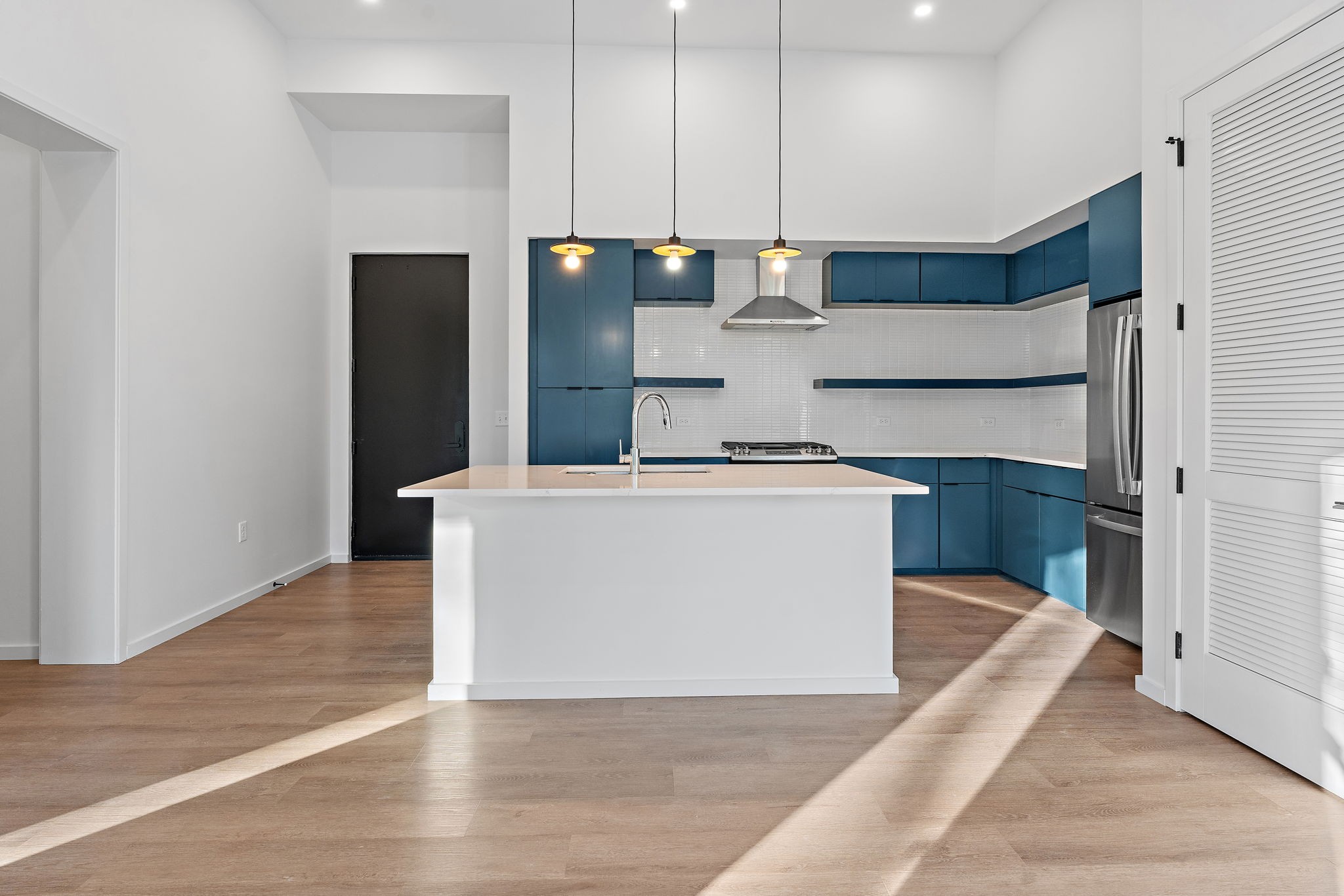 504 Merritt Avenue Nashville, TN 37203 - Photo 10 of 23 a kitchen with stainless steel appliances a refrigerator a stove a microwave and cabinets