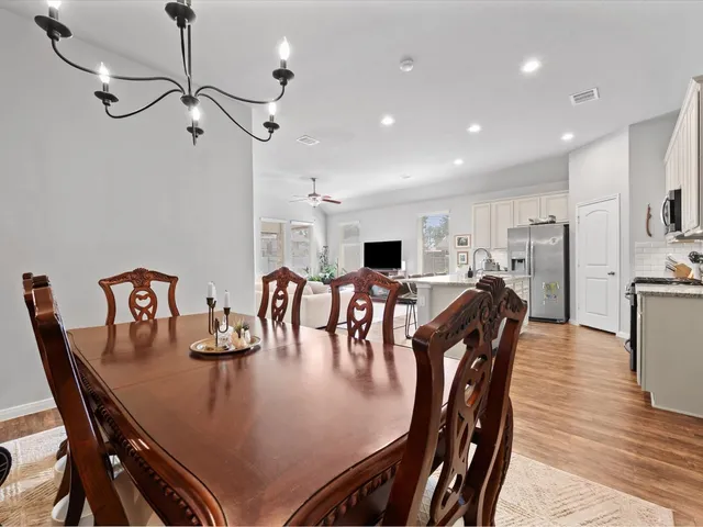 a view of a dining room with furniture