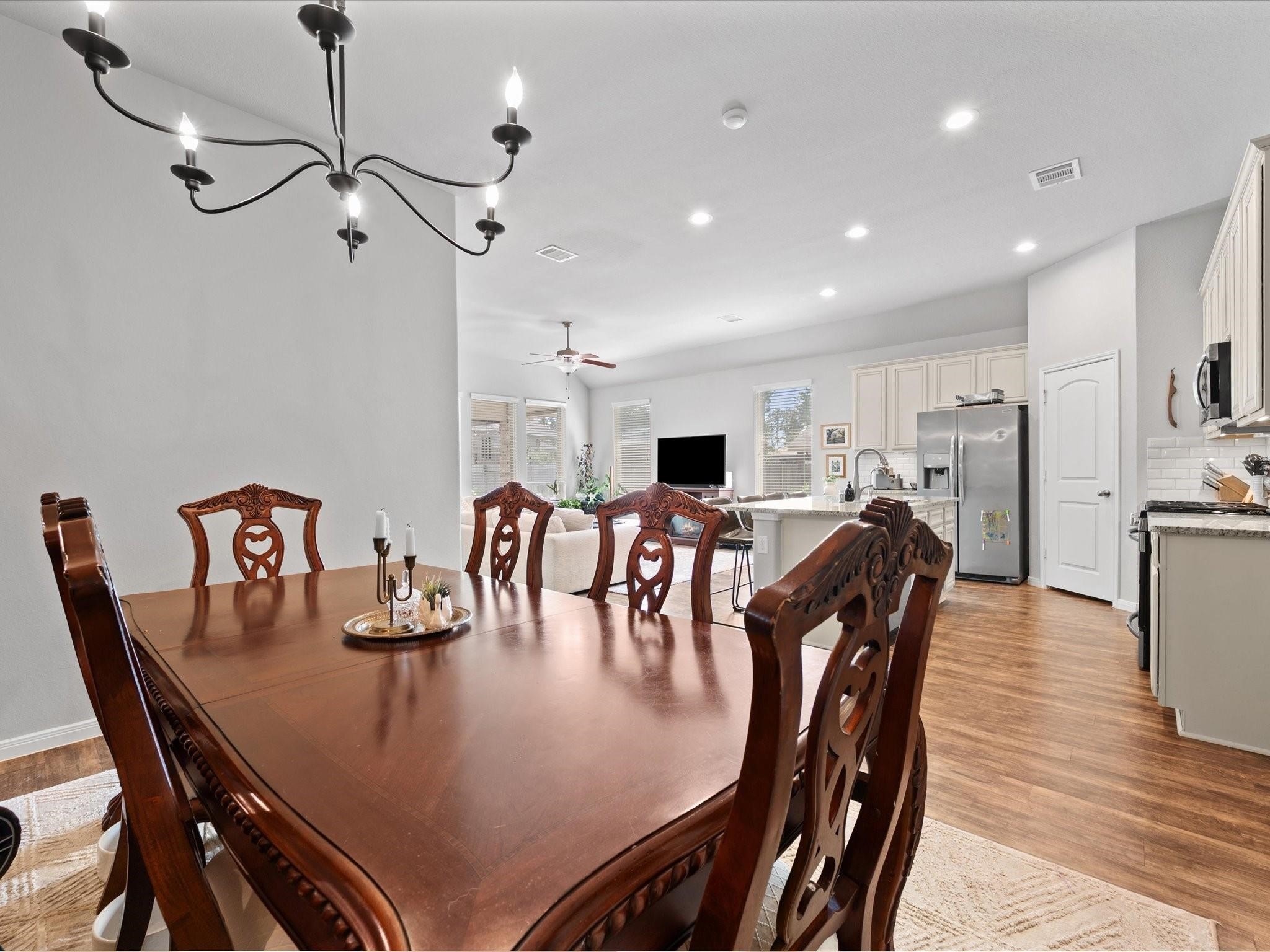 14381 Whitetop Peak Court Conroe, TX 77384 - Photo 11 of 39 a view of a dining room with furniture