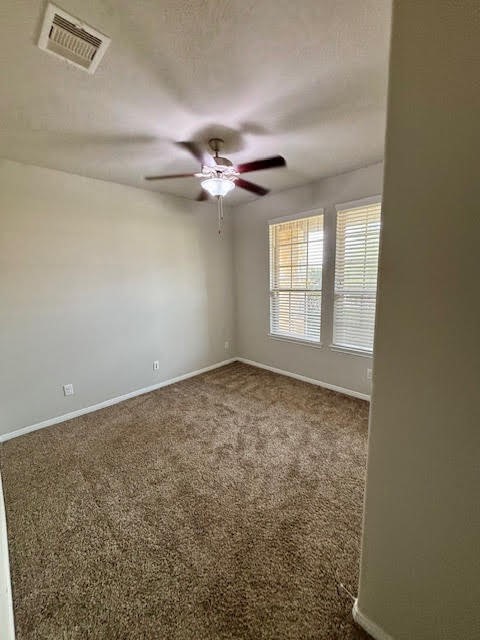 14381 Whitetop Peak Court Conroe, TX 77384 - Photo 16 of 39 an empty room with windows and ceiling fan