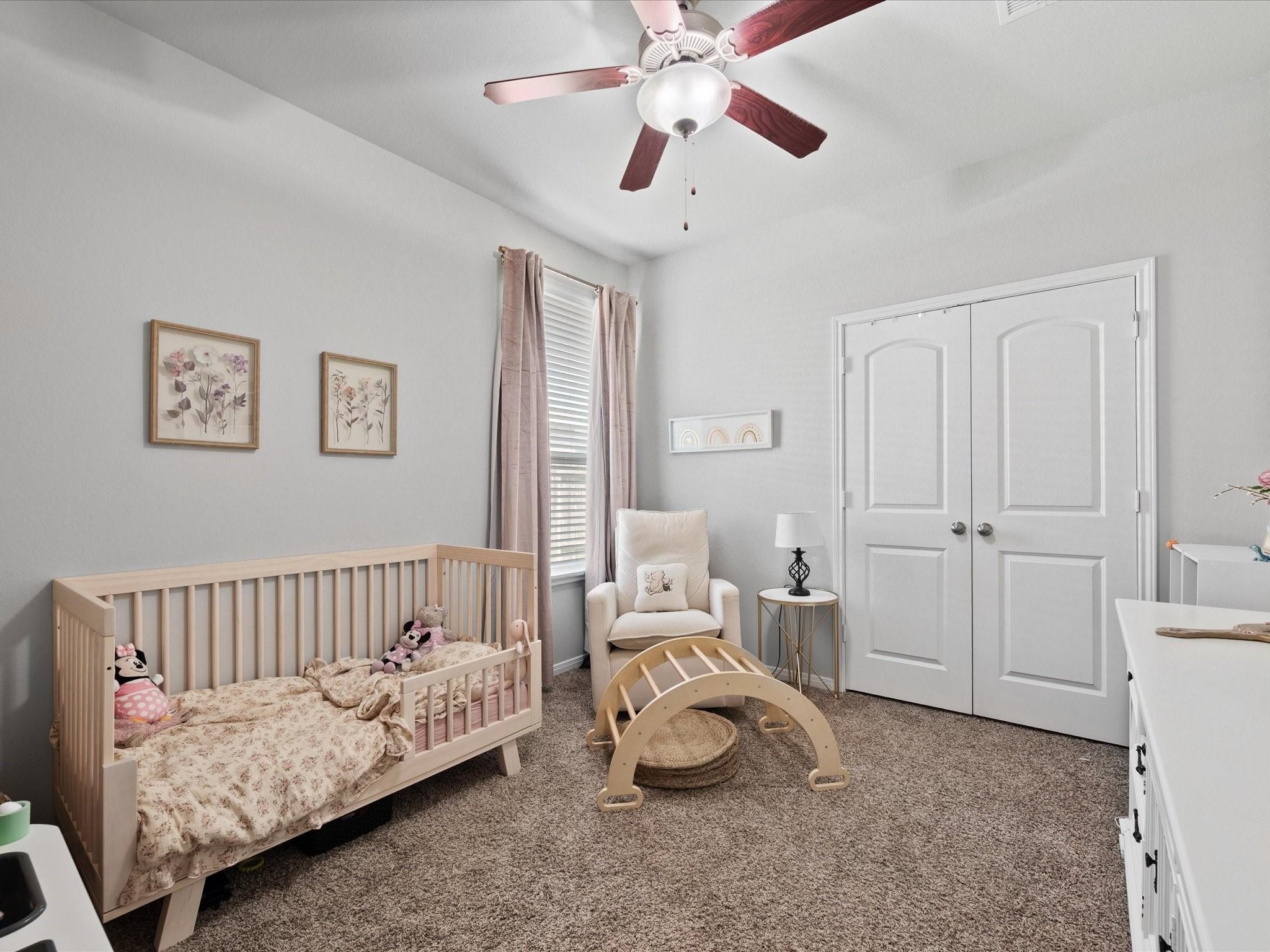 14381 Whitetop Peak Court Conroe, TX 77384 - Photo 17 of 39 a living room with furniture and a chandelier
