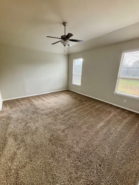14381 Whitetop Peak Court Conroe, TX 77384 - Photo 18 of 39 an empty room with windows and fan