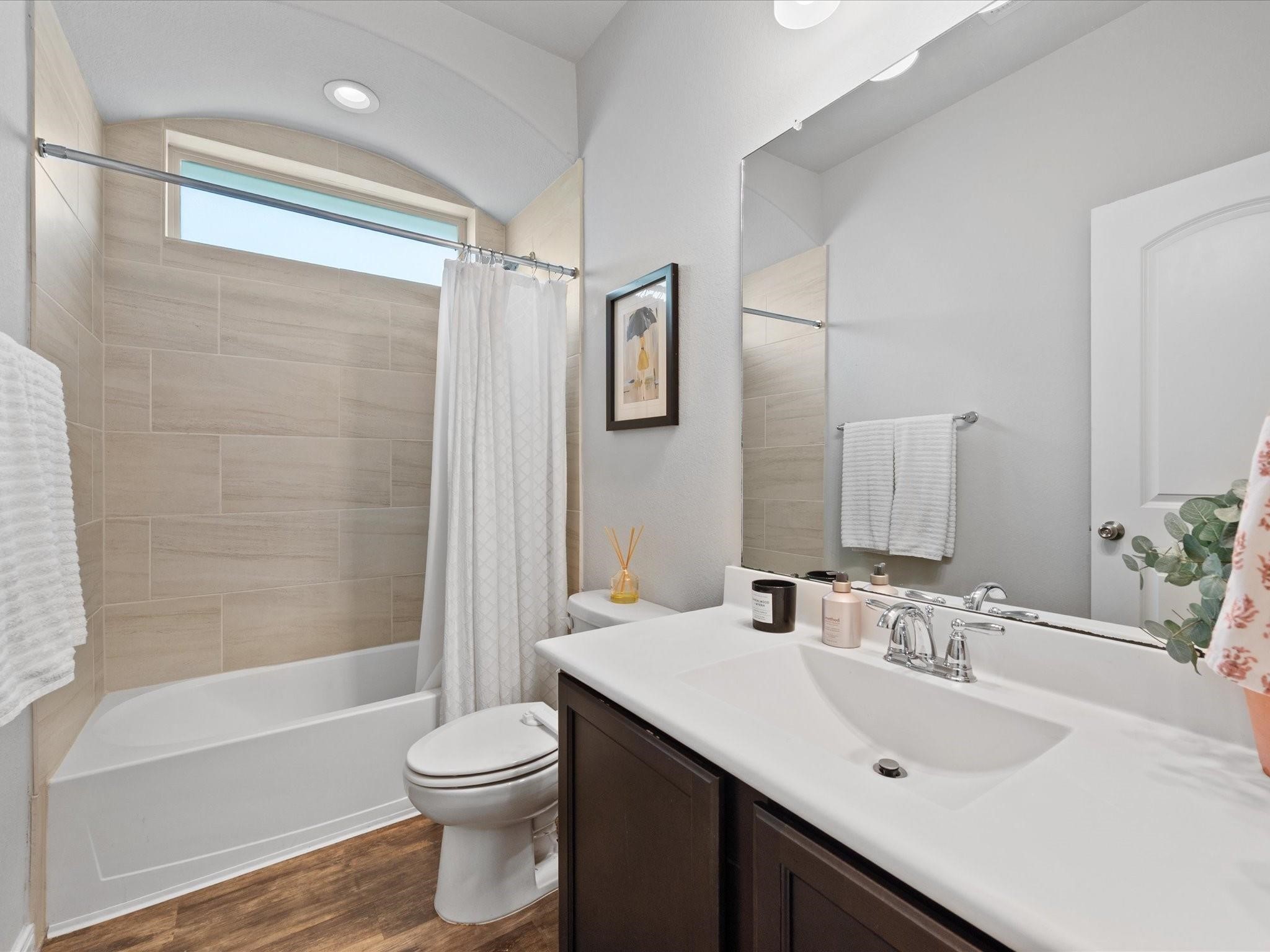 14381 Whitetop Peak Court Conroe, TX 77384 - Photo 20 of 39 a bathroom with a sink a toilet and shower